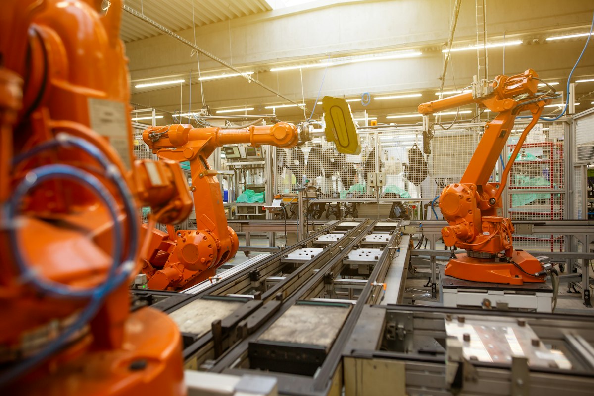 Industrial robots working on an automated factory production line